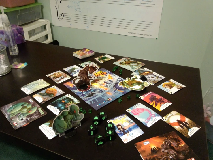 a table with cards and dice on it