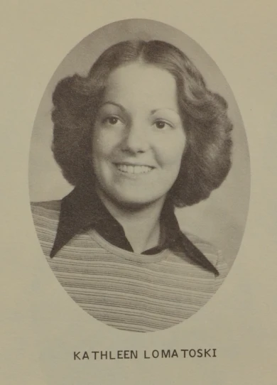 a black and white po of a woman smiling