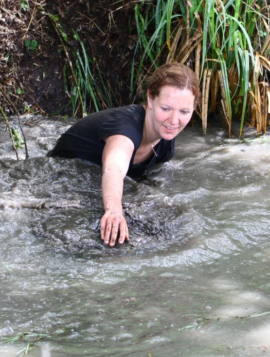 a woman who is falling into some water