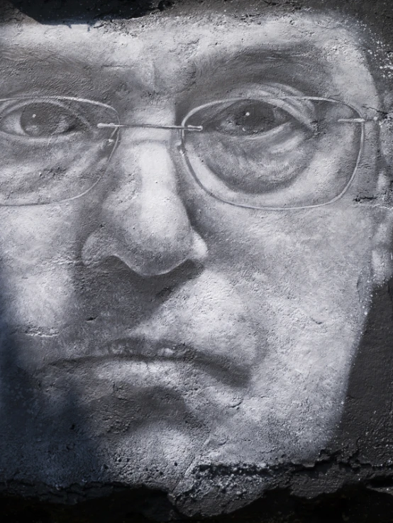 a drawing of a man in glasses on a wall