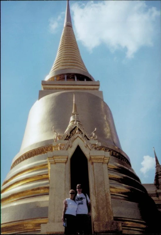 two men standing inside a building while posing for a po