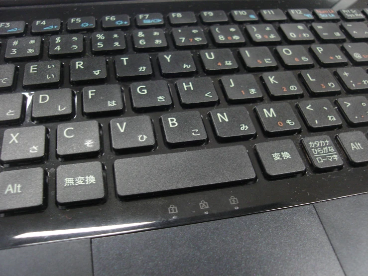 a close - up of a computer keyboard showing the chinese characters