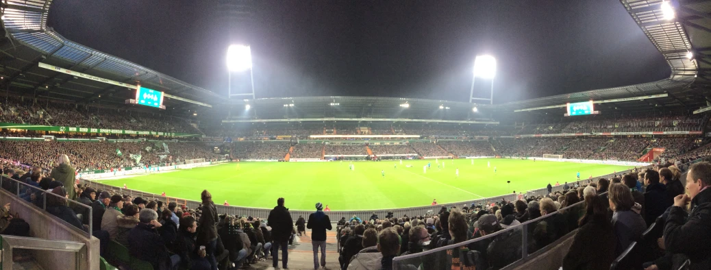 a stadium full of people watching a soccer match