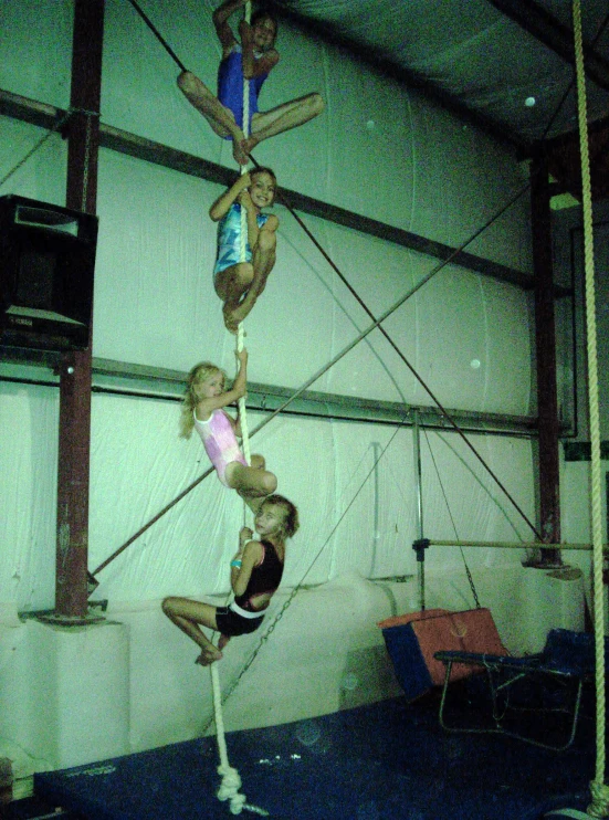 a girl standing on one leg in the air