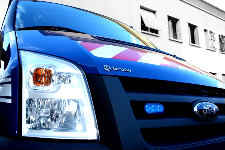 a closeup po of the front lights of a parked vehicle