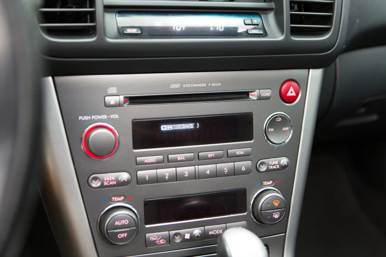 the radio panel in the dashboard of an automobile