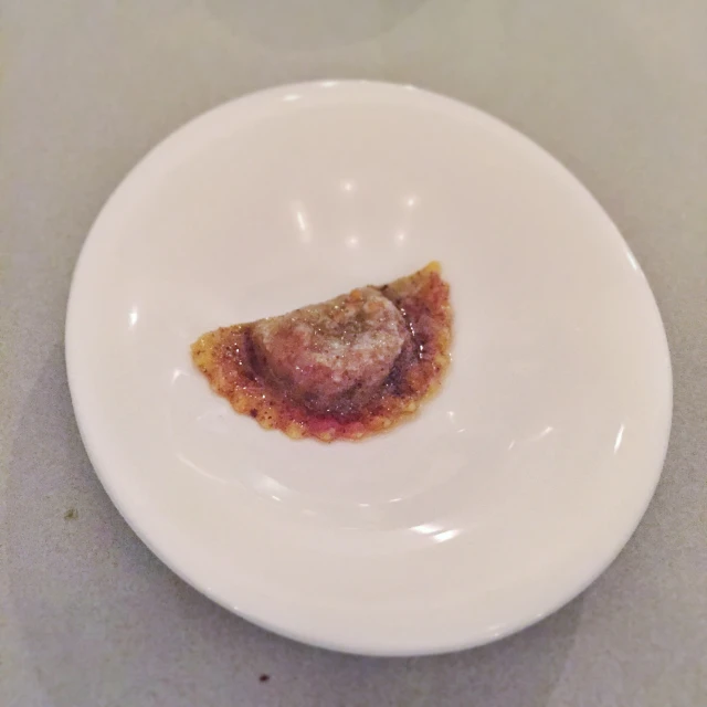 a plate topped with two pieces of food