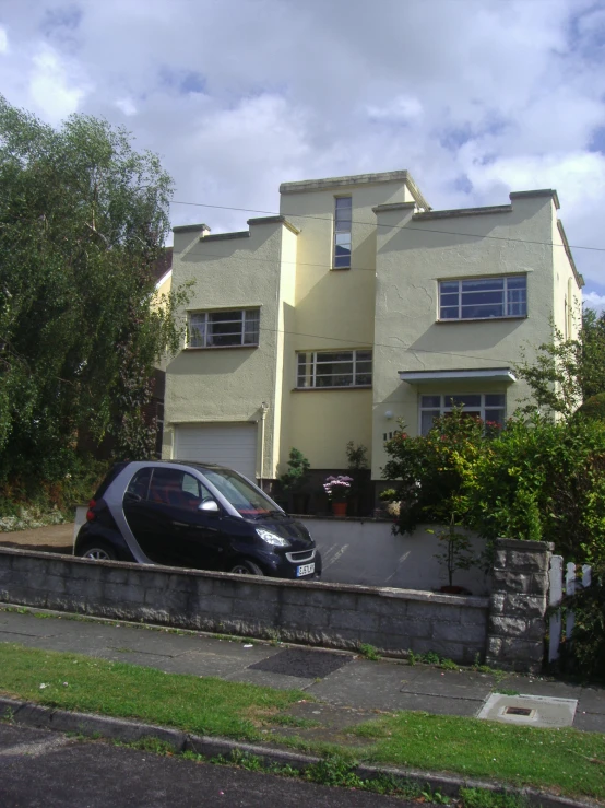 a car is parked in front of the house