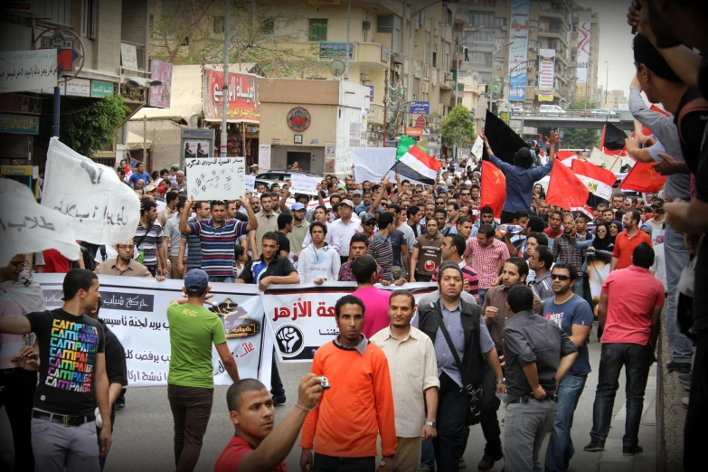 several people walking and holding signs