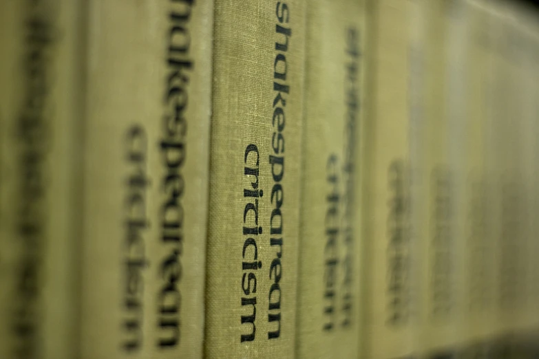 a close up of several books on a shelf