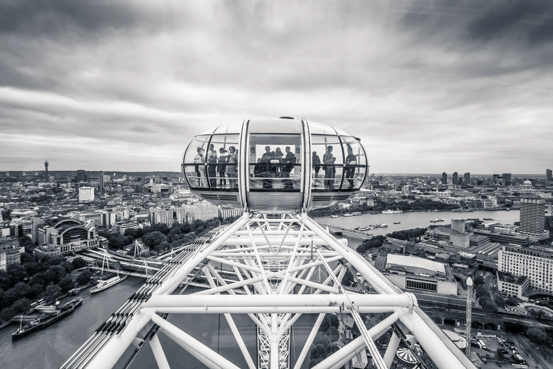 a black and white view of london at the ferris wheel