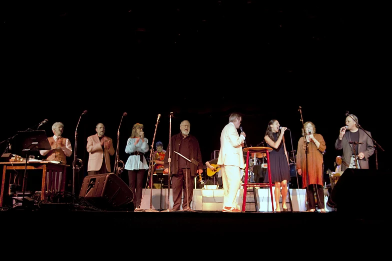 a group of people standing on a stage