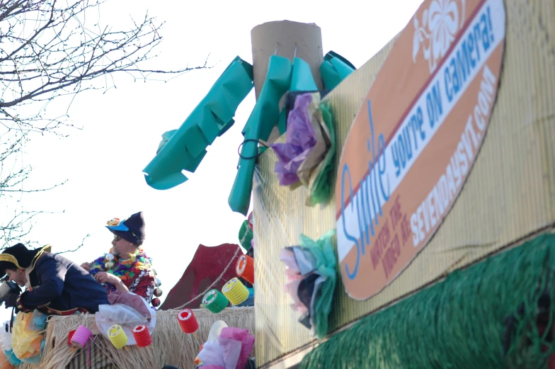 two children sitting on the raft of a float