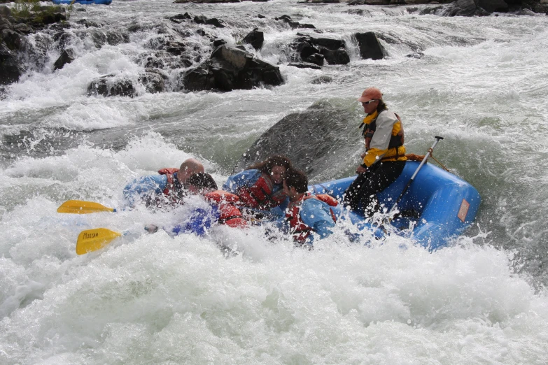 people are having fun on the rapids of the water