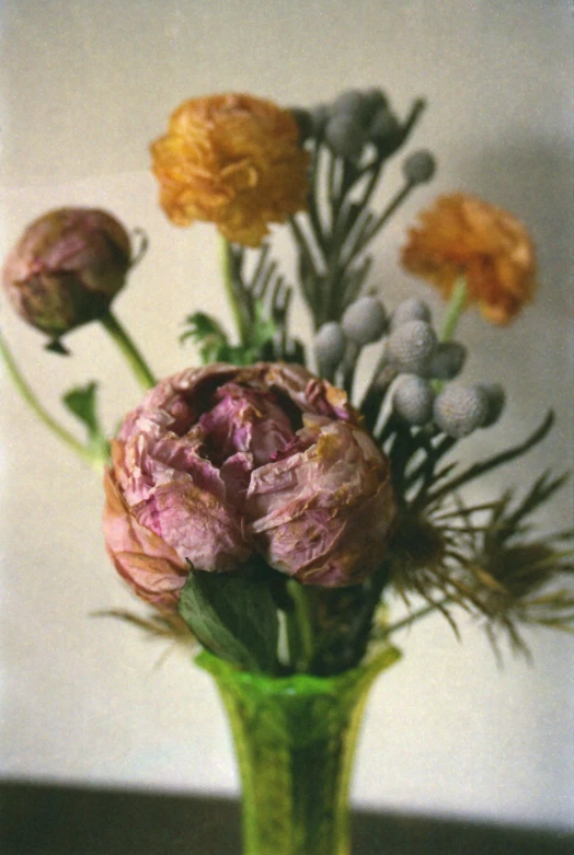 a vase with flowers on a table