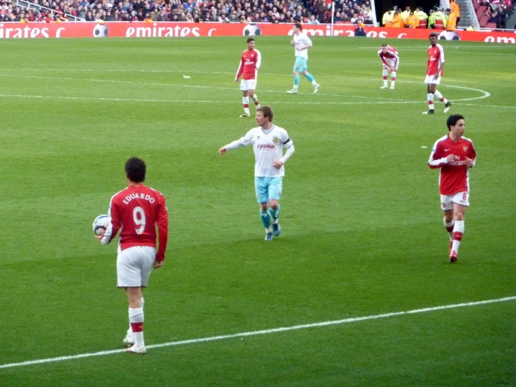 a group of young men on a field playing soccer