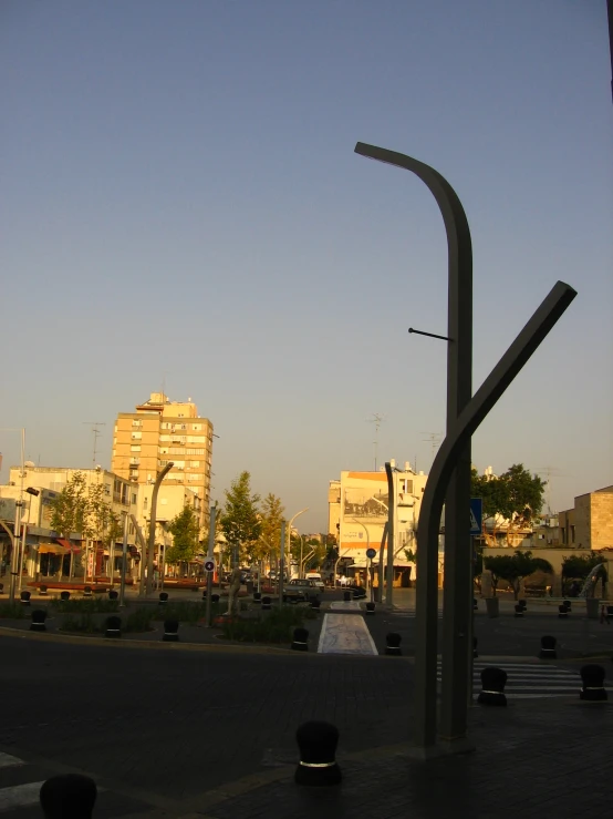 a tall clock with people walking around it