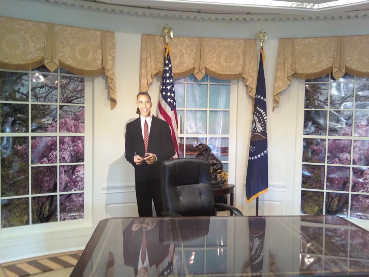 a po of president bush in a room that has many windows