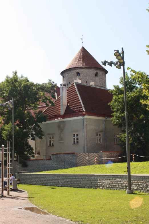 an old house with a very large brick turret