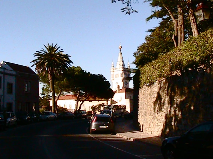 a line of cars sitting at the end of a street