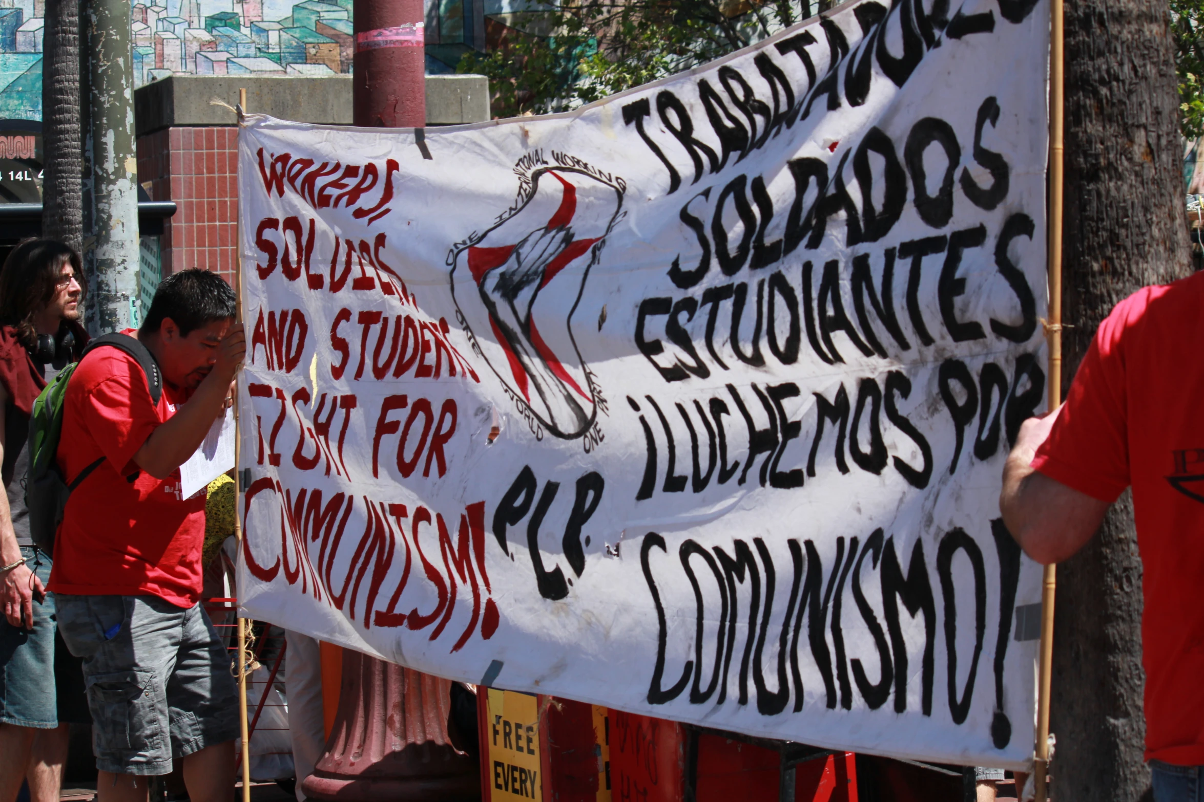 a group of protestors at a demonstration in front of a business