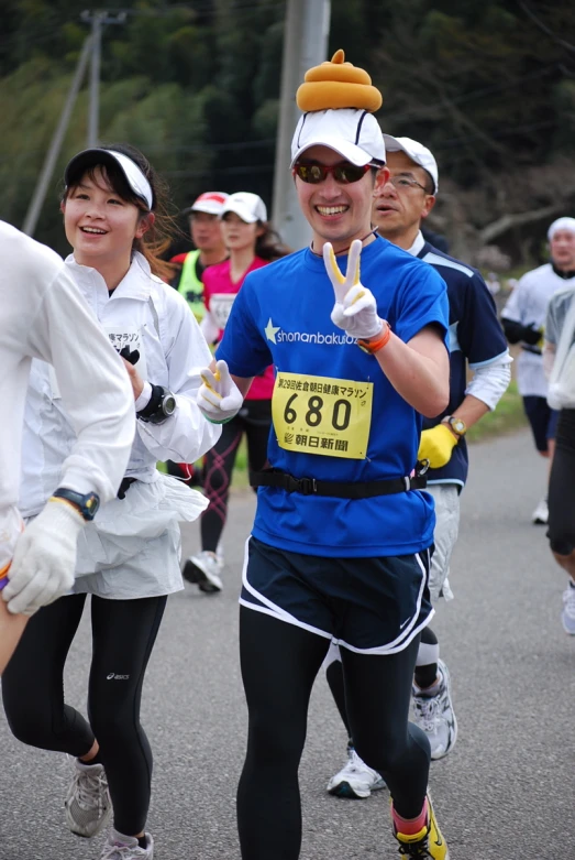 a couple of people are running together at a race