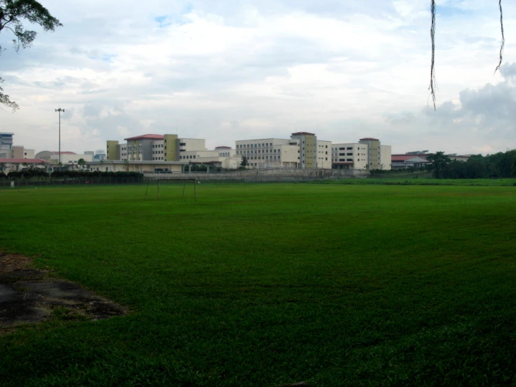 the field with some houses in it is empty