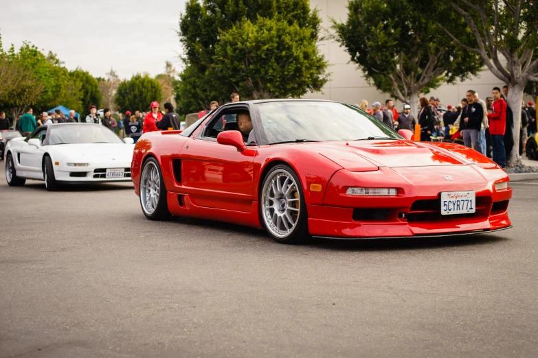 a red sports car parked on the street