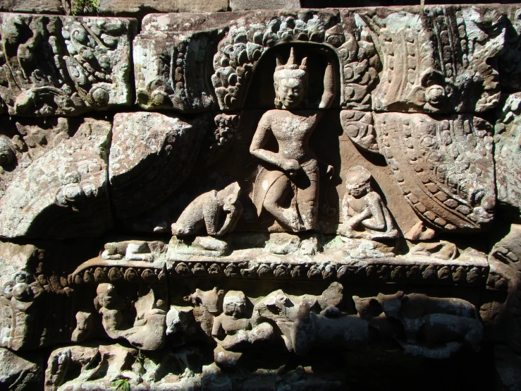 there is a stone relief carving depicting buddha