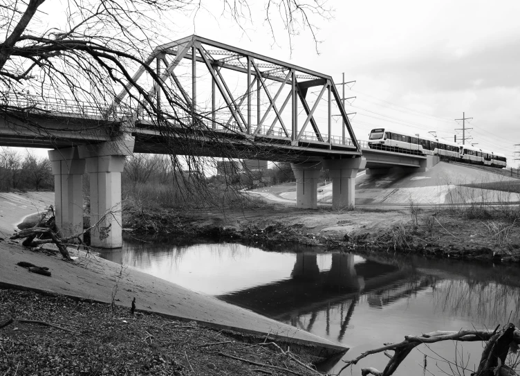 the train passes over the bridge and across the water