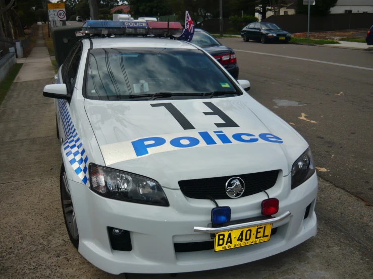 a police car parked on the side of the street