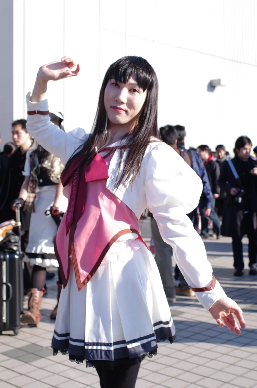 a girl in school uniform posing for a po