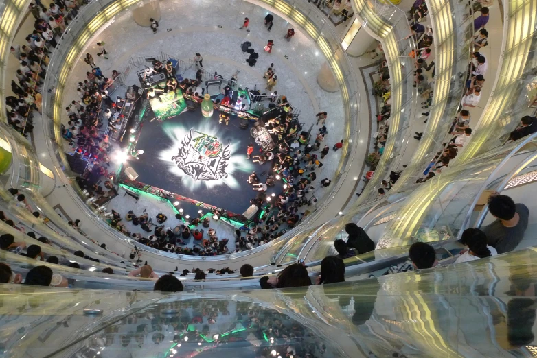 a very large crowd of people in an atrium