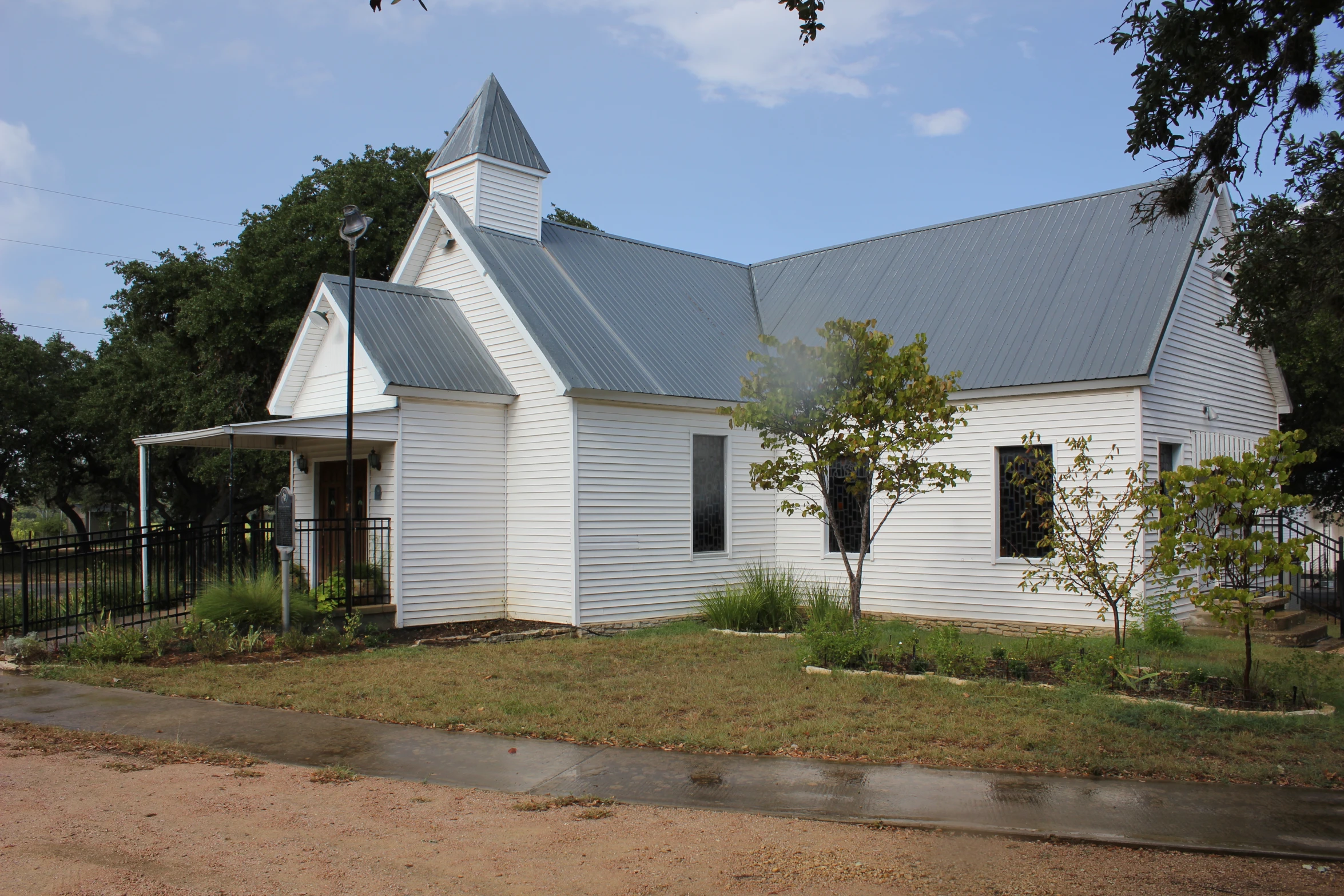 an old church in the city park is white