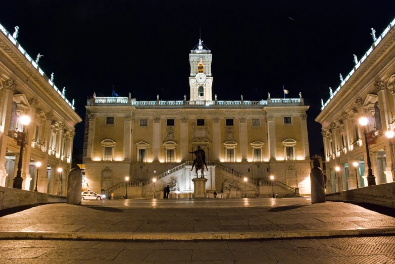 a wide s of the building with the fountain in front