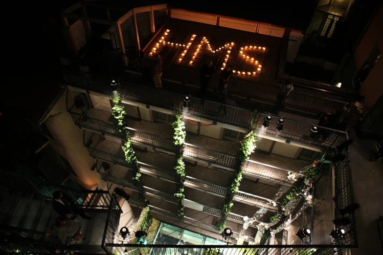 an overhead view of some people standing on top of a building