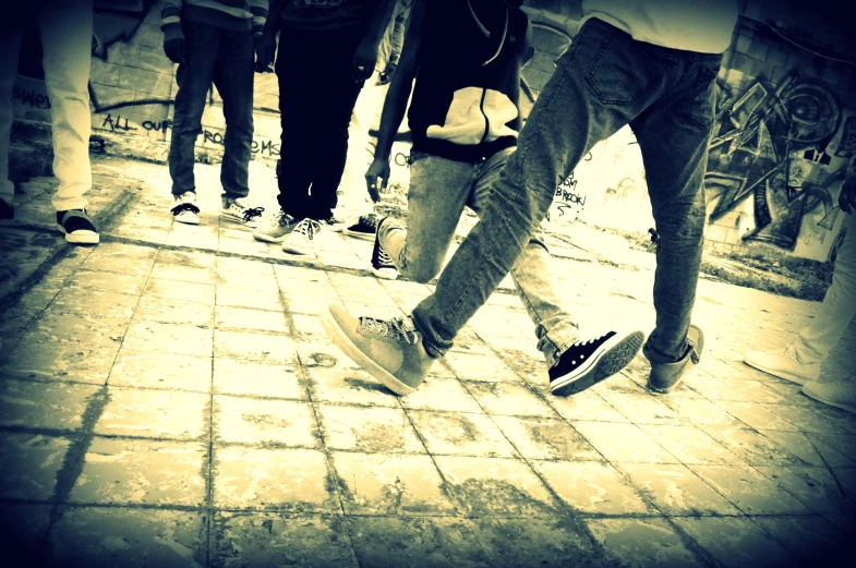 a group of skateboarders with their skateboards