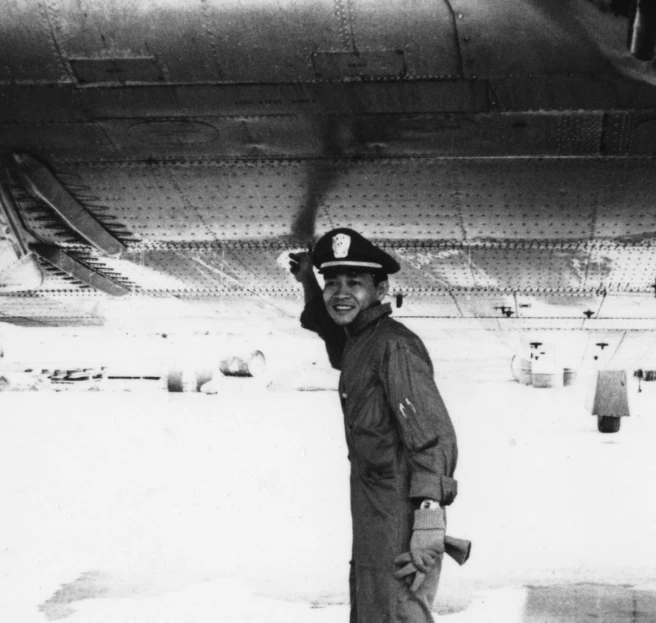 a black and white image of a man in uniform