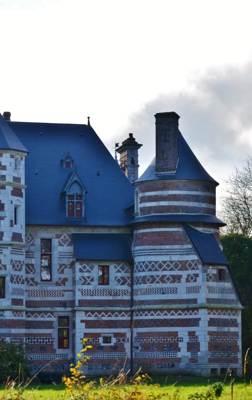 an old building with ornate windows and a large balcony