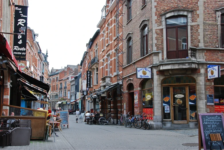 some buildings shops street and a bike parked