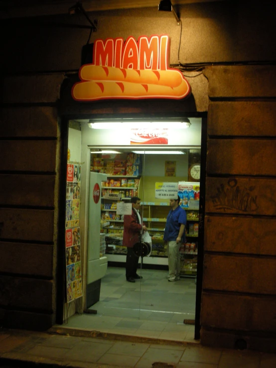 a shop with two people out front of it