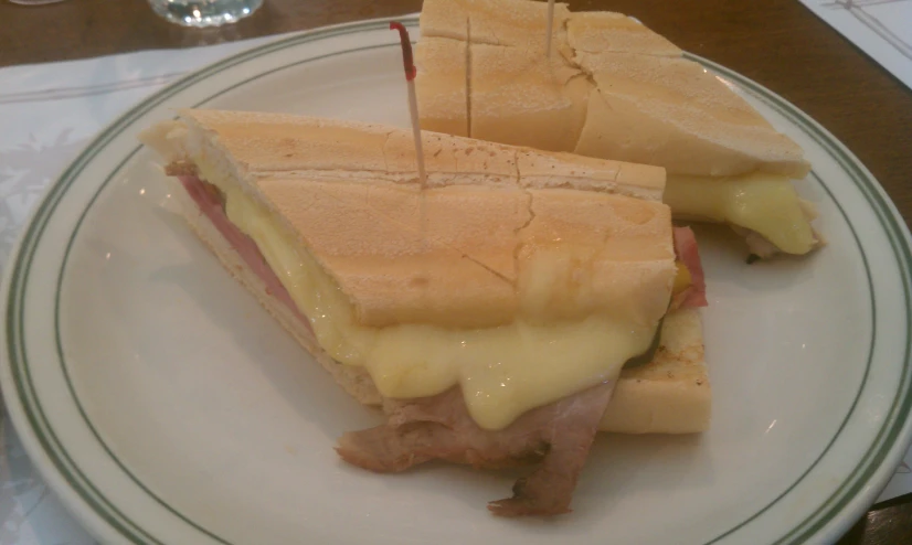 a close up of a plate with a sandwich on it