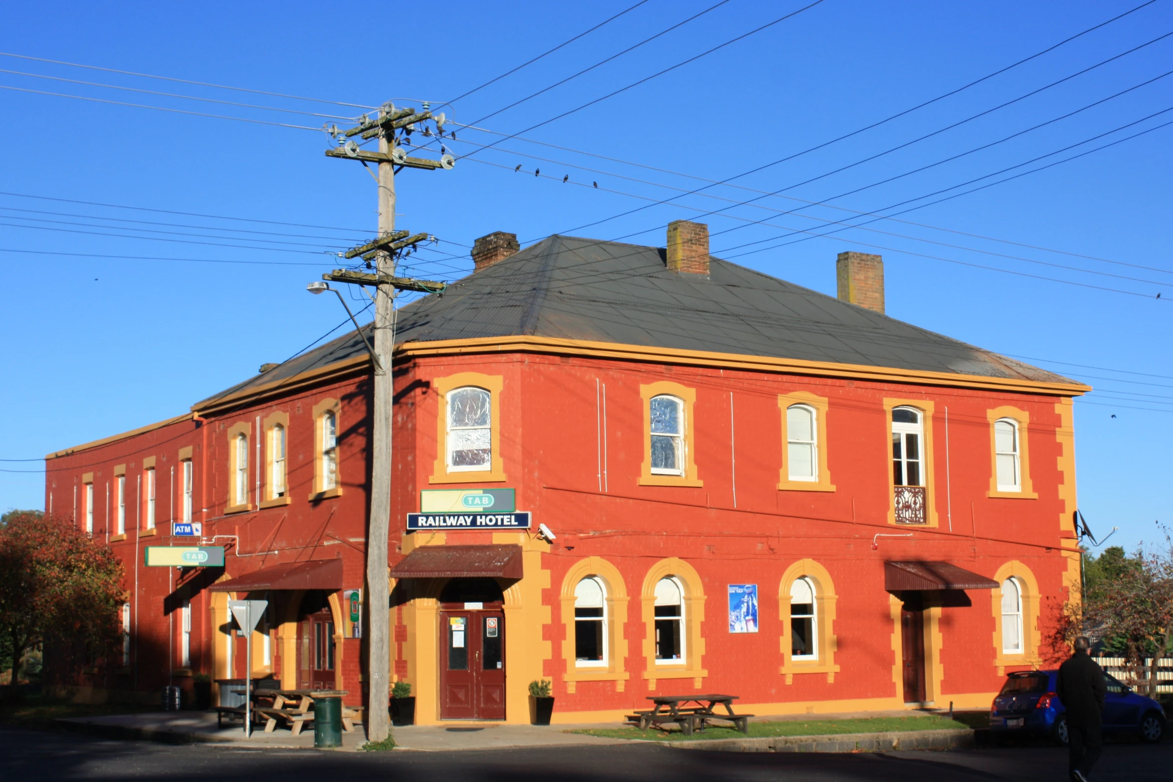 there is a red building on the street corner