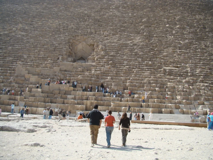 the two people walk near the steps that are all over the place