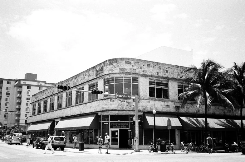 a black and white image of a street corner