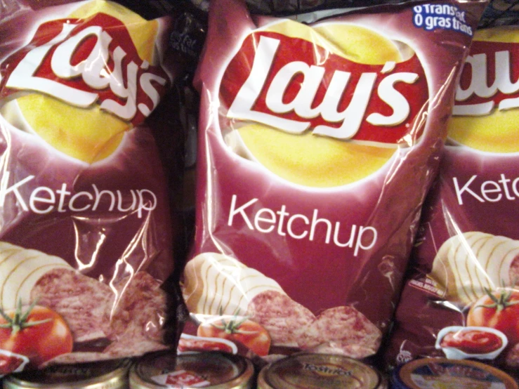 two packages of lays ketchup and potato chips