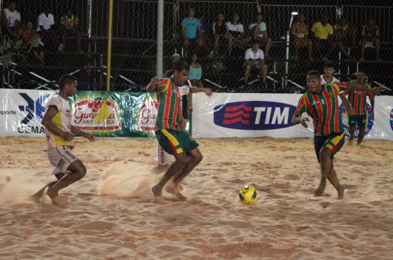 a group of young men kicking around a soccer ball