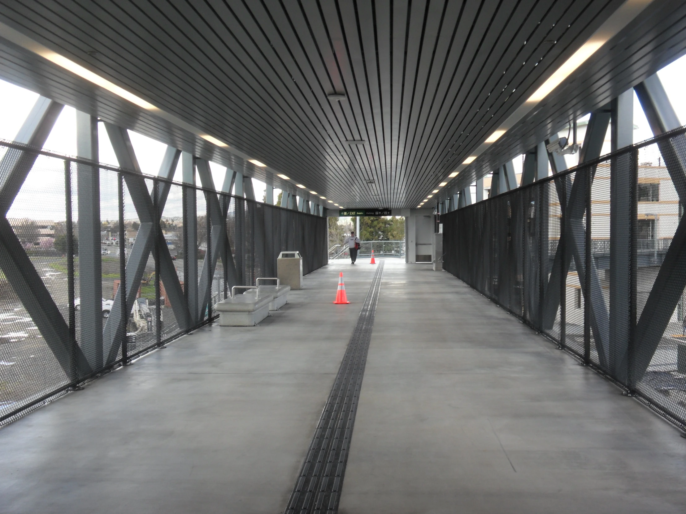 walkway and gates in enclosed space on overcast day