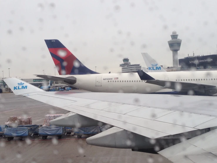 a view of some planes that are parked in the airport