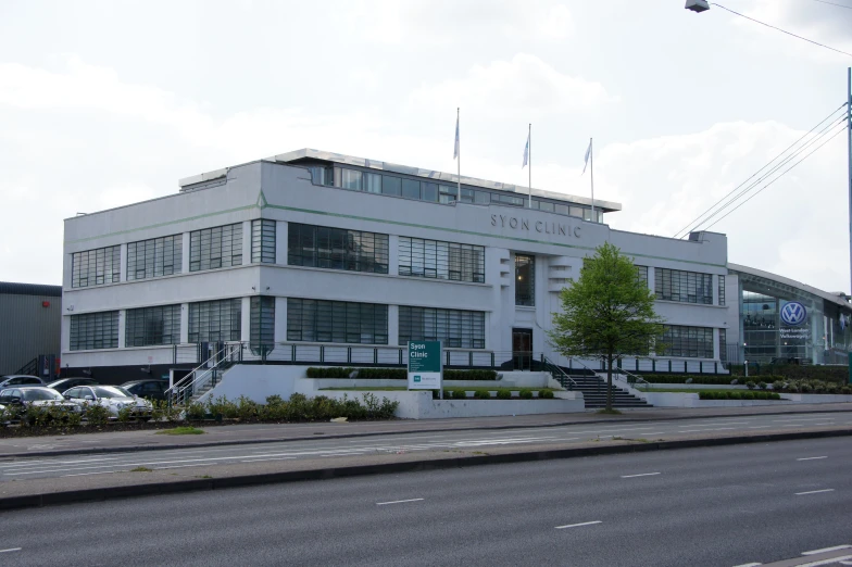 a large white building sitting on the side of a street